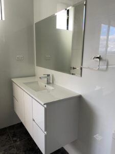 Contemporary toilet with tiled flooring